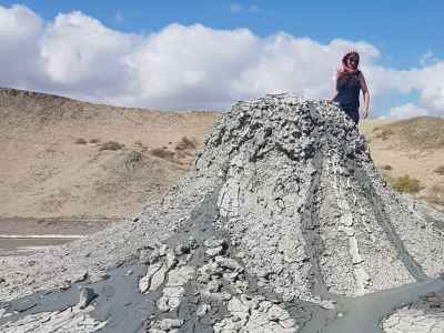 Mechthild Doll climbing mud volcano