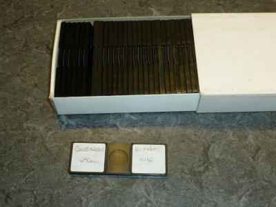 Plastic microslide for storing foraminifera, and cardboard box for storing the microslides.