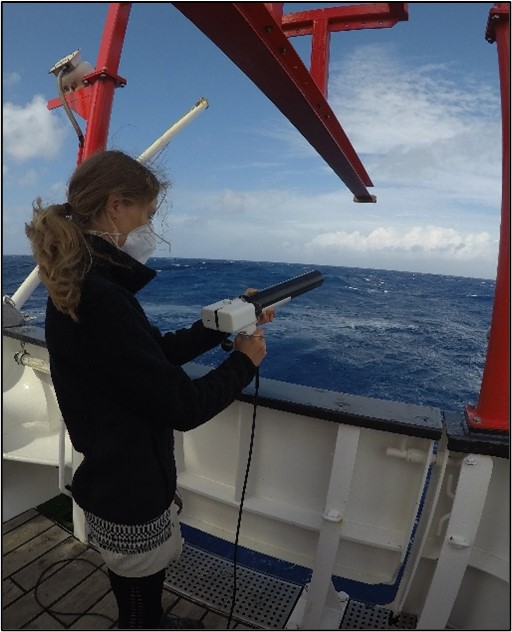 Mona Lütjens shooting an XSV probe to measure the water column sound velocity.