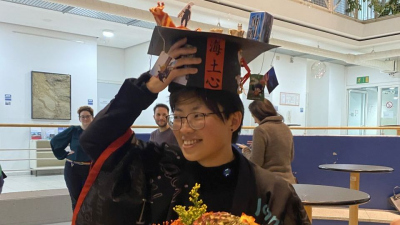 Yiting Tseng with her doctoral hat