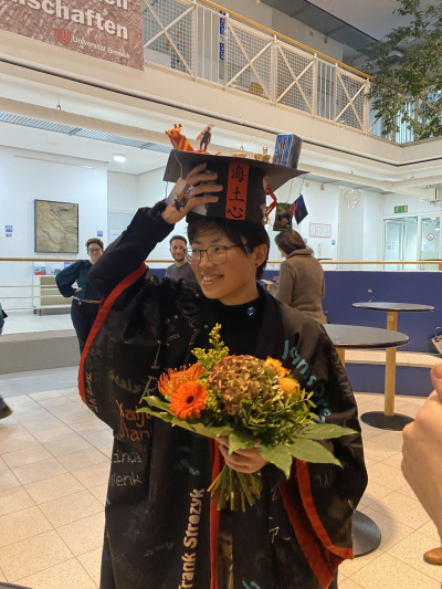 Yiting with her doctoral hat