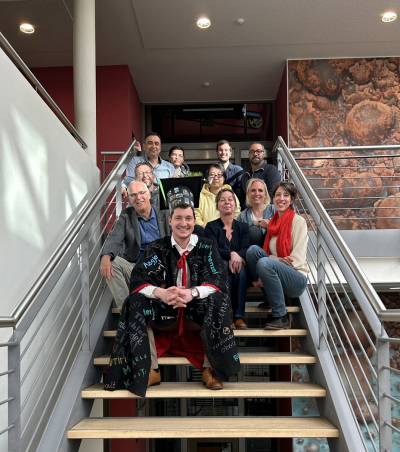 Jens and his working group sitting on the stairs of the MARUM I building