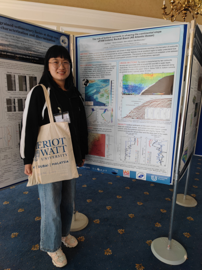 Ling presenting her poster at the 4 th DWC