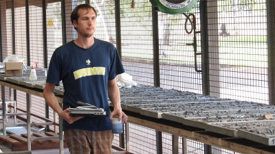 Geochemist Benjamin Nettersheim studying and sampling cores of the 1.64 Ga Barney Creek Formation in the core shed of the Northern Territories Geological Survey, Darwin. Photo:  Christian Hallmann