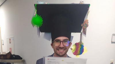 Mattia Ghilardi with his doctoral hat and certificate