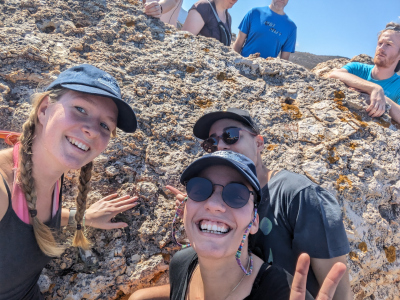Photo of Eirini, Areti Belka and Joely infront of fossilized gas bubbles