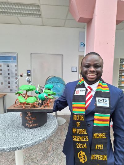 Michael Kyei Agyekum with his scarf and doctor's hat at his side
