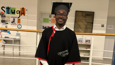 Opeyemi Ogunleye with his doctoral hat and cape