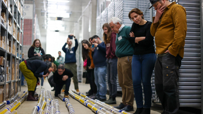 IODP Exp 389 science party members look at the cores at the IODP Bremen Core repository, located at MARUM - Center for Marine Environmental Sciences, University of Bremen. Photo: Parker(at)ECORD_IODP