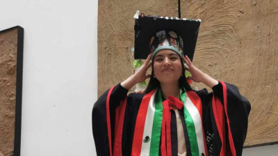 Karla Rubio Sandoval with her doctoral hat