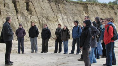 group of people in a sand pit